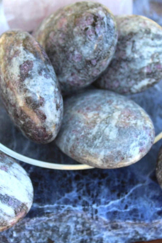 This Pink Garnet palm stone said to promote self-love.