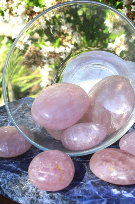 Rose Quartz palm stone known as the LOVE stone