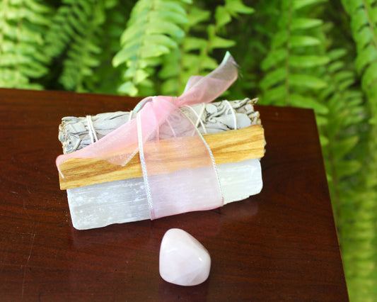 selenite and rose quartz bundled with sage and palo santo